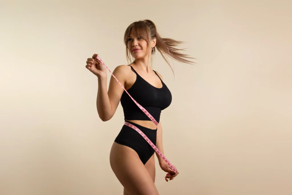 Woman holding measuring tape.